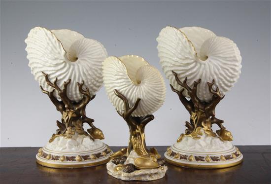 Three Royal Worcester nautilus shell vases, late 19th century, 22cm and 17.5cm